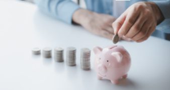 Person with pile of coins and piggy bank, money saving concept for future use and financial stability, salary management, personal finance, investment savings.